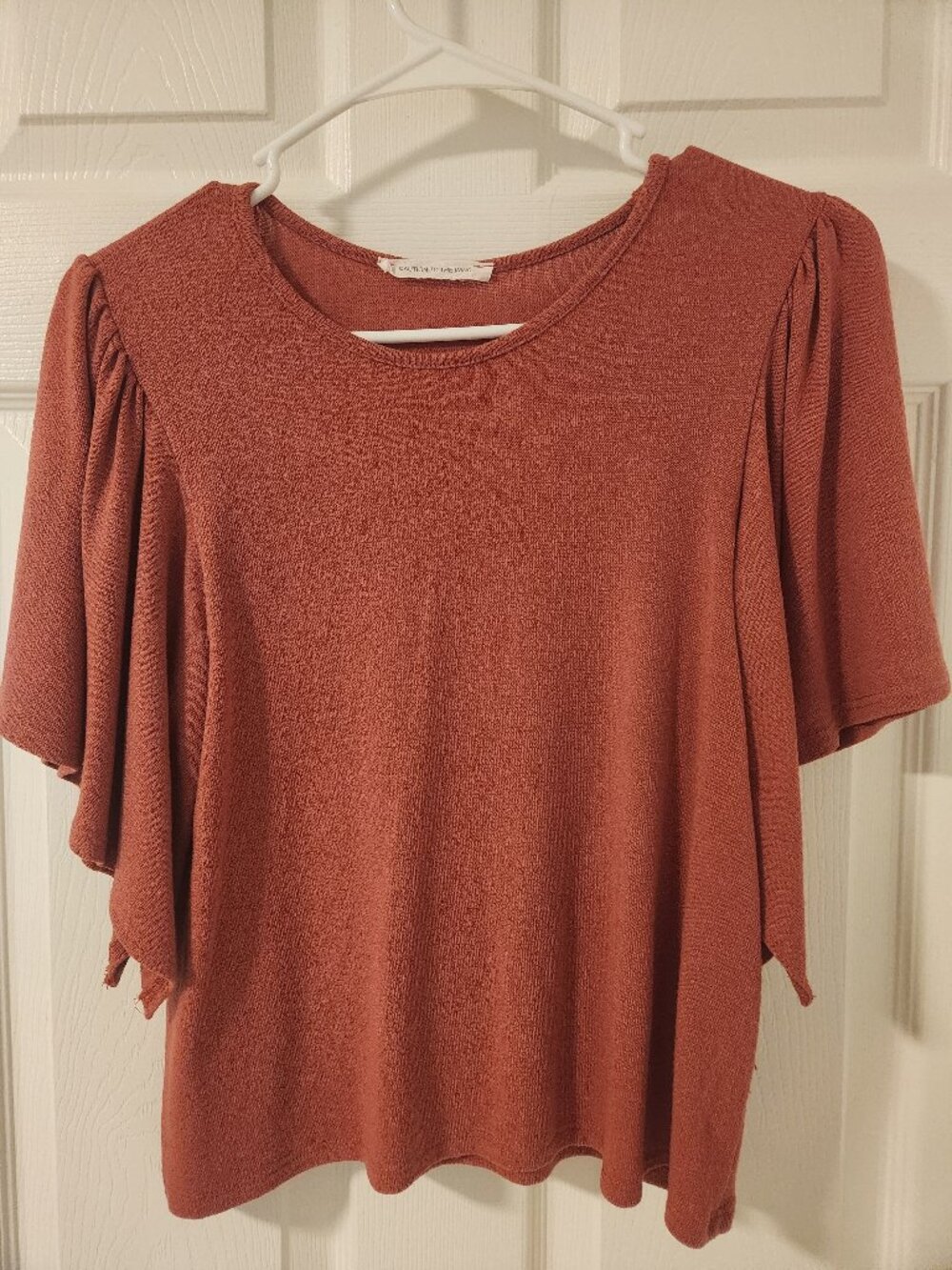 Burnt orange women's bell sleeved sweater size 4